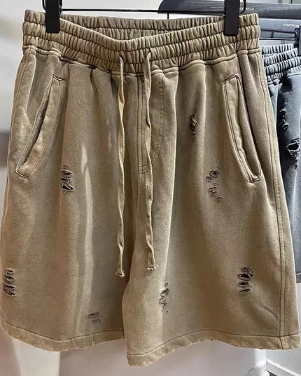 Cut-Up Vintage Shorts – Distressed Denim with Raw Hem